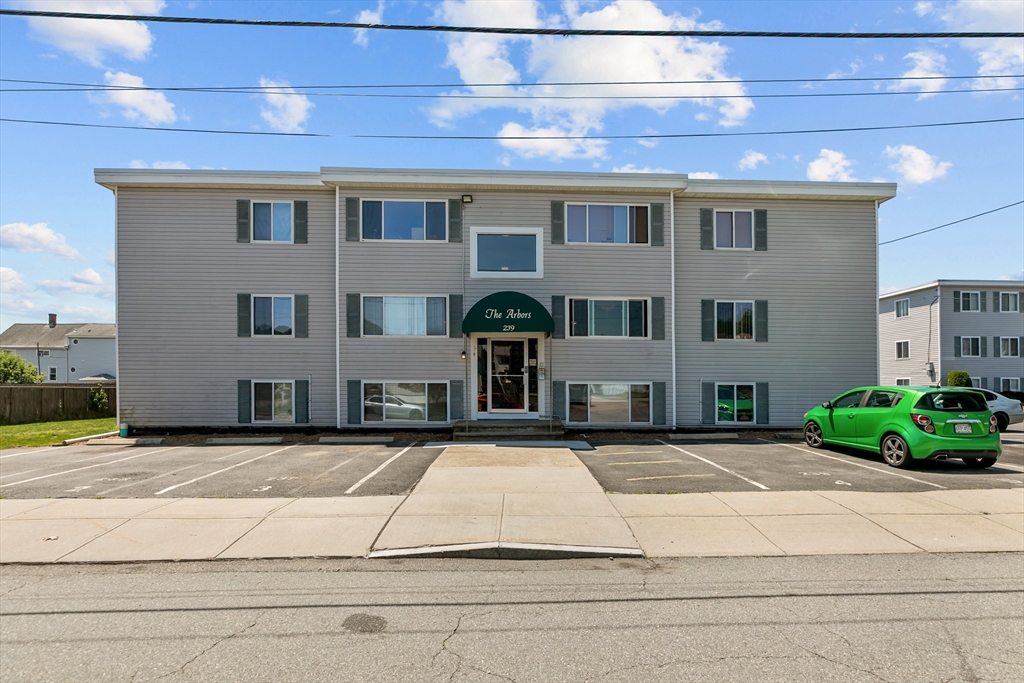 239 Glasgow Street, Unit 12 Fall River, MA 02721 - Photo 1 of 29 a front view of a building with garden