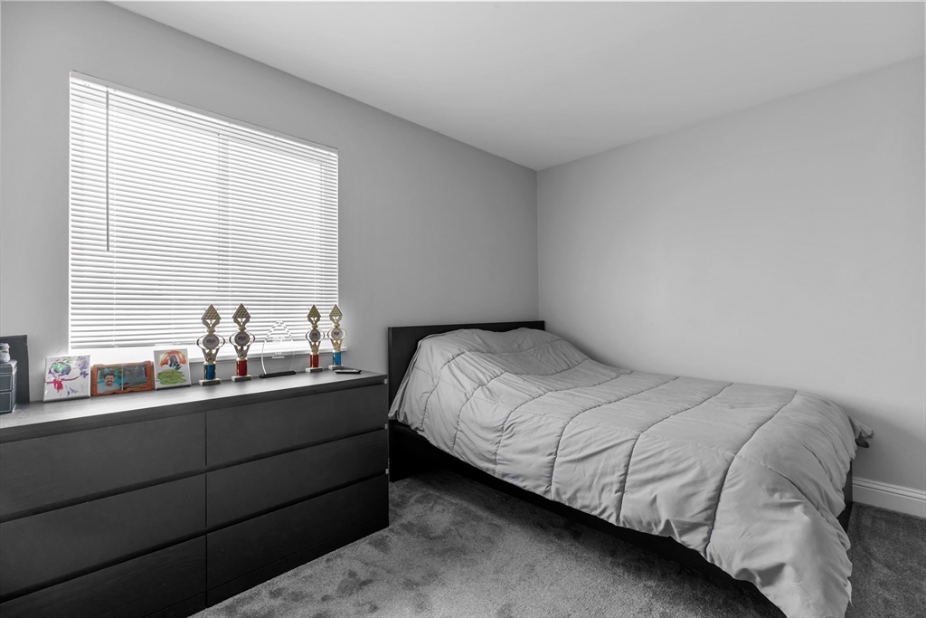 239 Glasgow Street, Unit 12 Fall River, MA 02721 - Photo 20 of 29 a bedroom with a bed and window