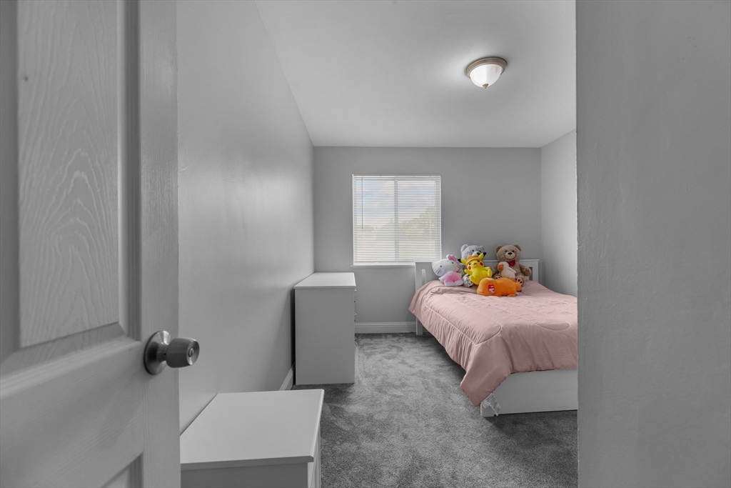 239 Glasgow Street, Unit 12 Fall River, MA 02721 - Photo 22 of 29 a bedroom with bed and window