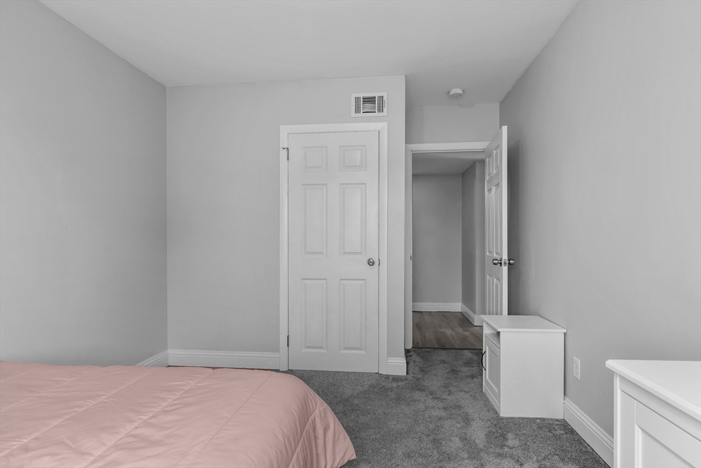 239 Glasgow Street, Unit 12 Fall River, MA 02721 - Photo 24 of 29 a bedroom with a bed and a bathroom