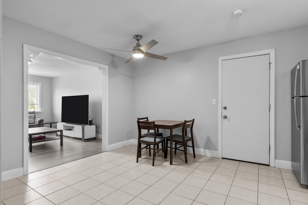 239 Glasgow Street, Unit 12 Fall River, MA 02721 - Photo 6 of 29 a view of a livingroom with furniture and a flat screen tv