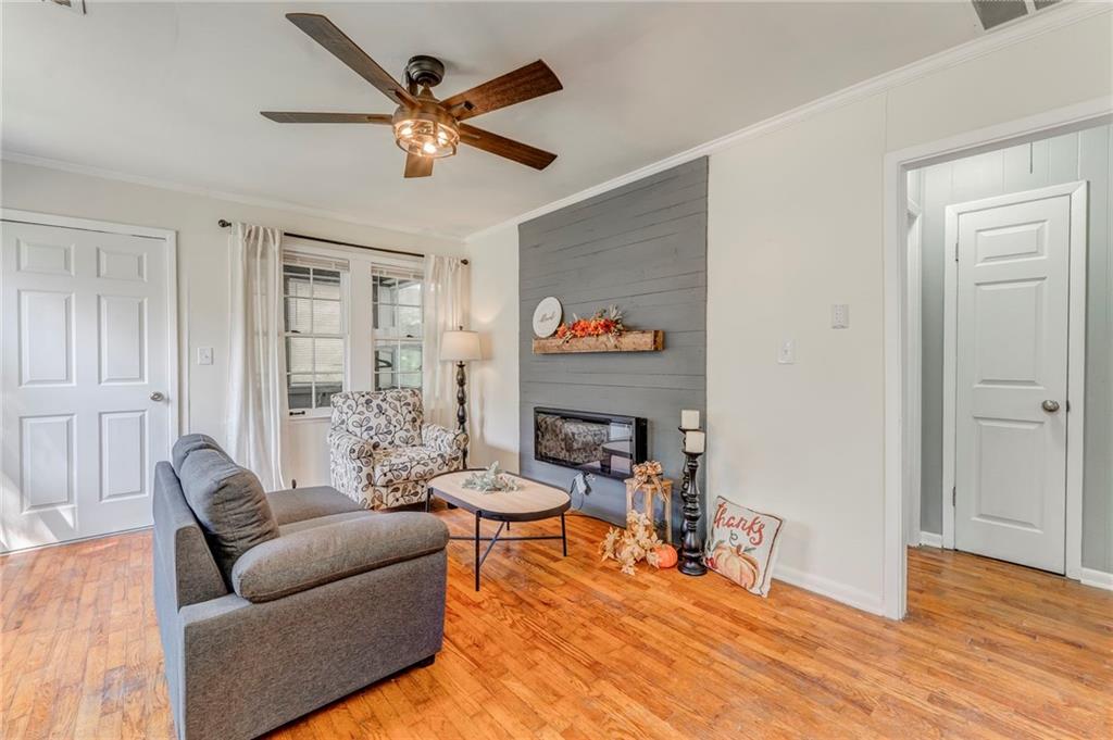 2005 Highland Circle Rome, GA 30161 - Photo 11 of 36 a living room with furniture and a wooden floor