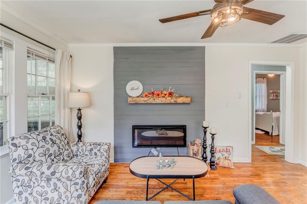 2005 Highland Circle Rome, GA 30161 - Photo 13 of 36 a living room with furniture and a fireplace