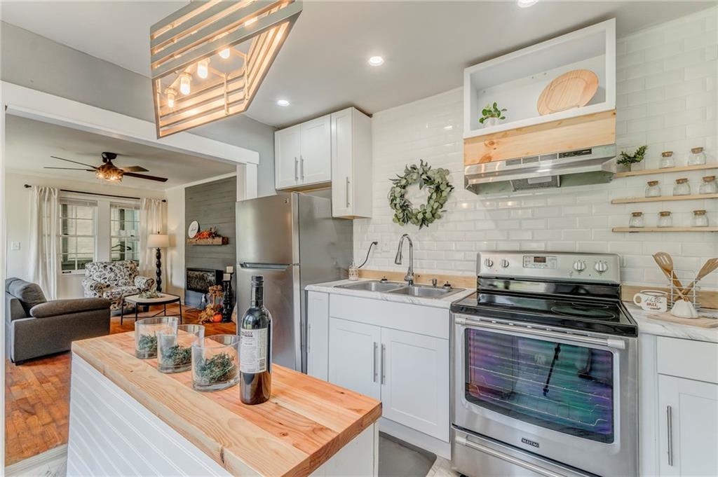 2005 Highland Circle Rome, GA 30161 - Photo 16 of 36 a kitchen with a stove and a sink