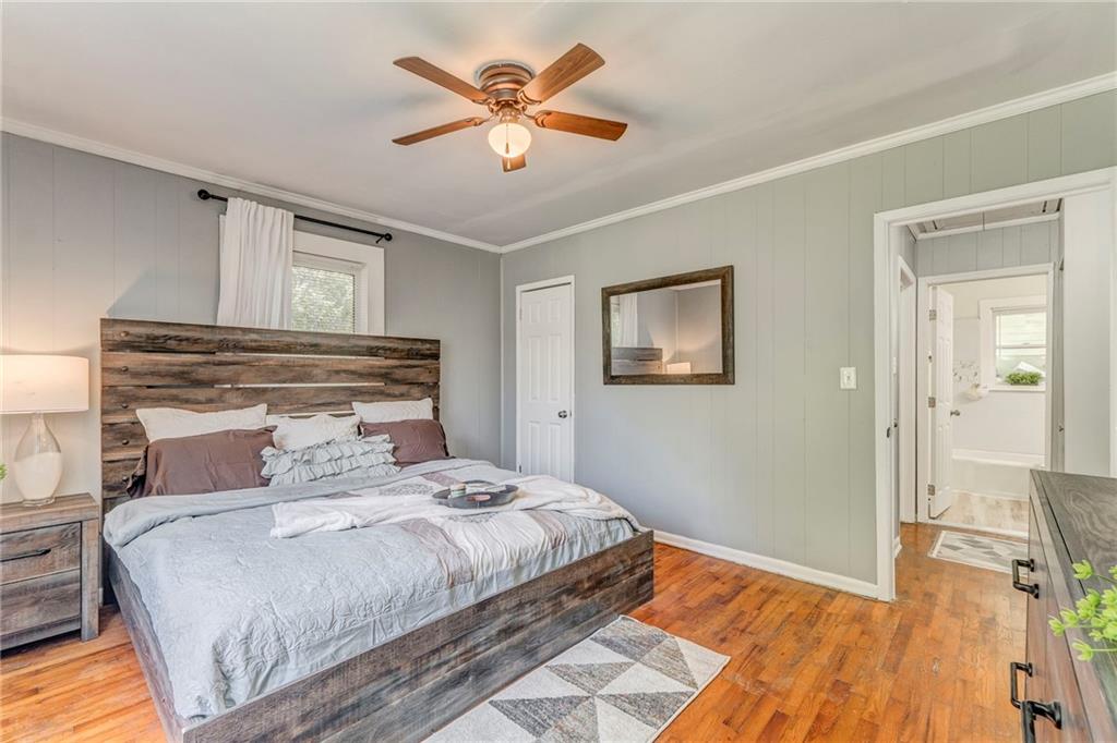 2005 Highland Circle Rome, GA 30161 - Photo 23 of 36 a bedroom with a bed and a chandelier