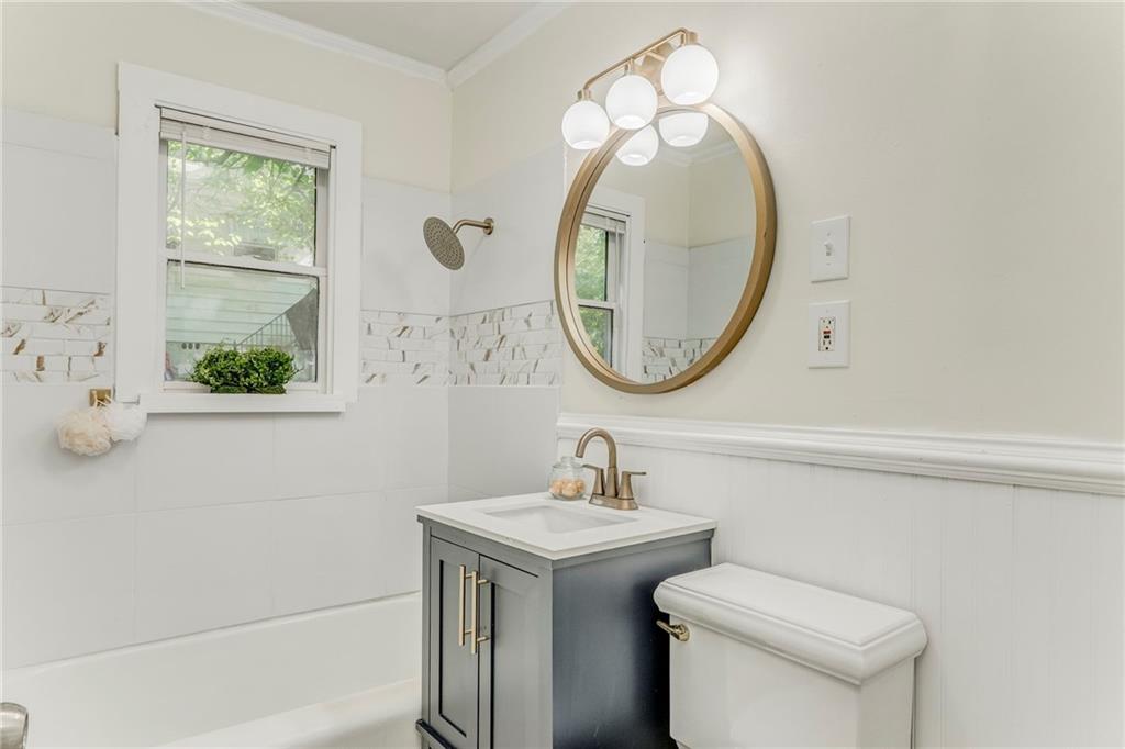 2005 Highland Circle Rome, GA 30161 - Photo 26 of 36 a bathroom with a toilet sink and mirror