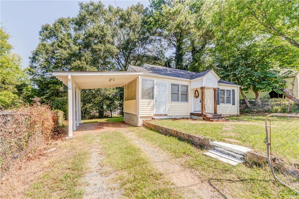2005 Highland Circle Rome, GA 30161 - Photo 31 of 36 a view of a house with backyard and a garden