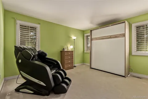 a view of a room with gym equipment and windows