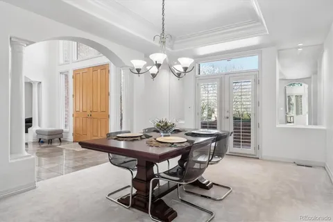a front view of a house with a yard table and chairs