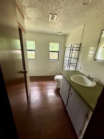 a bathroom with sink and mirror