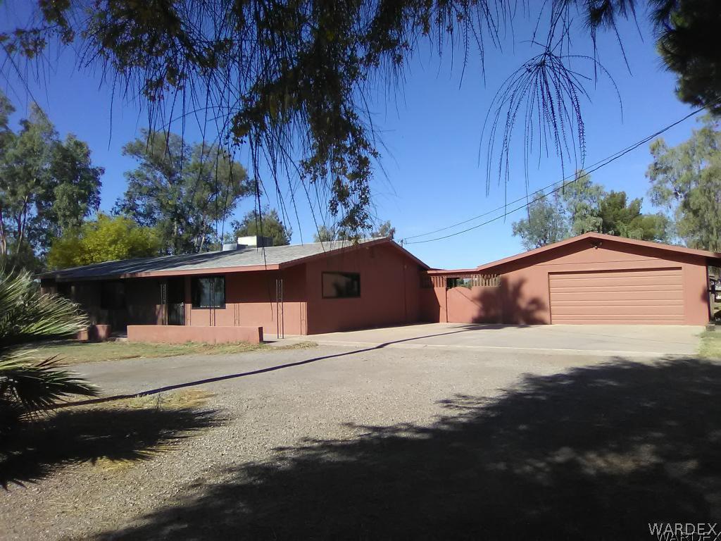 8485 Boundary Peak Road Mohave Valley, AZ 86440 - Photo 1 of 40 a front view of a house with a yard