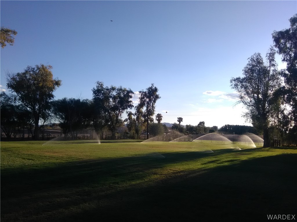 8485 Boundary Peak Road Mohave Valley, AZ 86440 - Photo 14 of 40 a view of a golf course with a lake