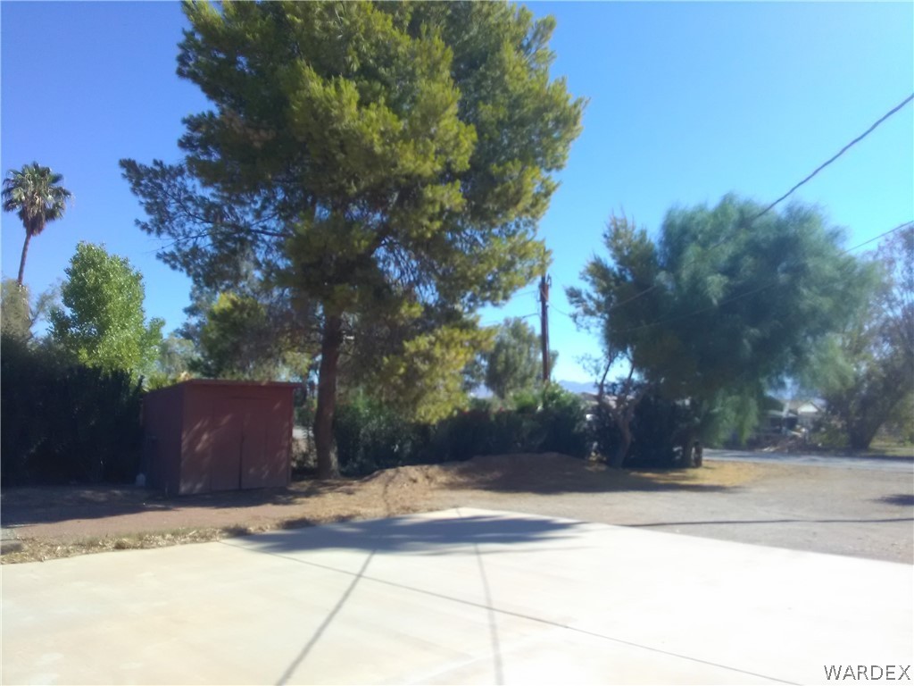8485 Boundary Peak Road Mohave Valley, AZ 86440 - Photo 24 of 40 a view of a house with a yard and tree s