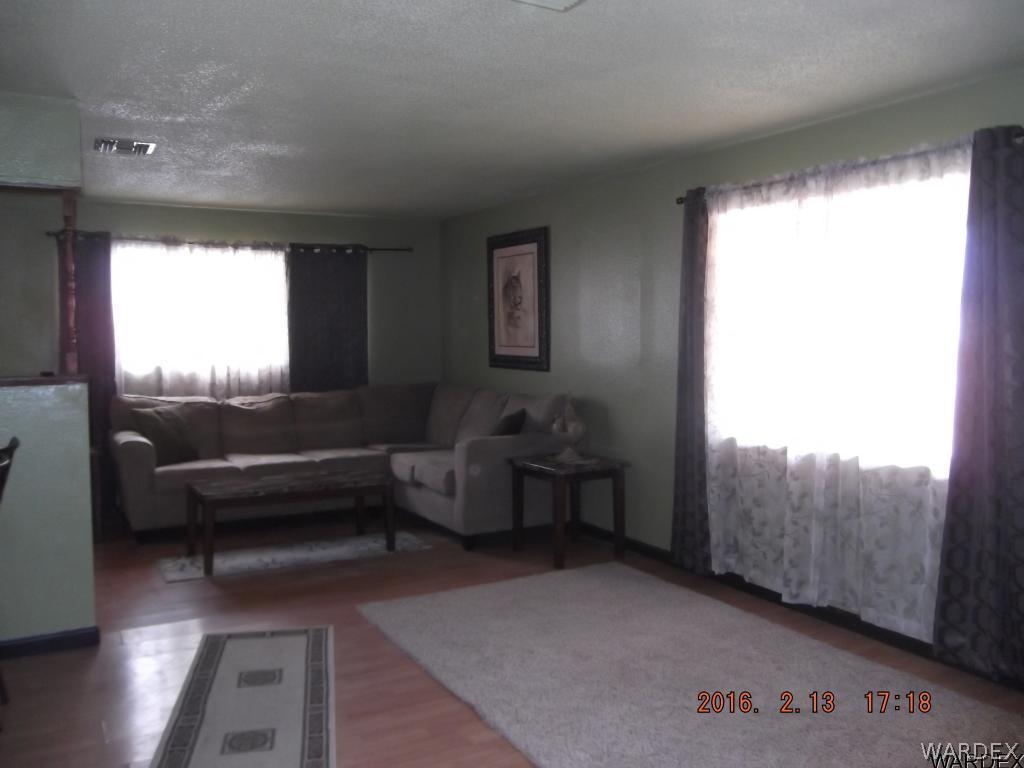 8485 Boundary Peak Road Mohave Valley, AZ 86440 - Photo 27 of 40 a living room with furniture and a large window