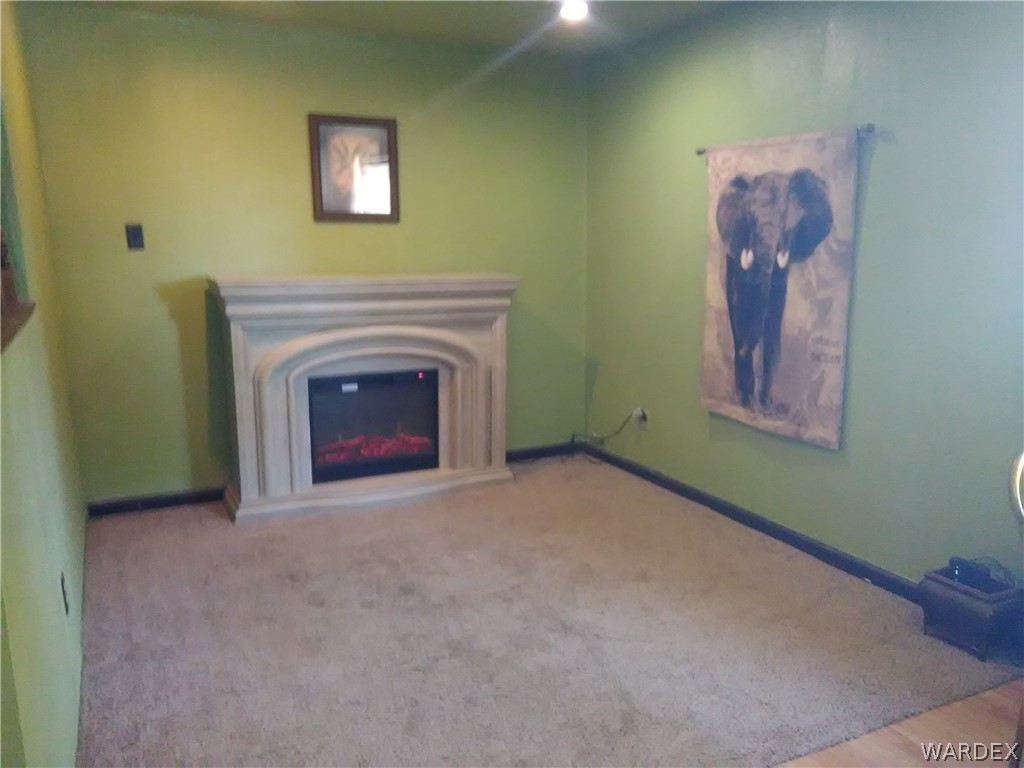 8485 Boundary Peak Road Mohave Valley, AZ 86440 - Photo 28 of 40 a view of empty room with a fireplace