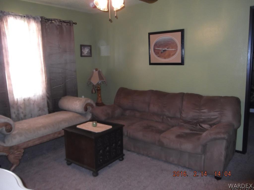 8485 Boundary Peak Road Mohave Valley, AZ 86440 - Photo 32 of 40 a living room with furniture and a window