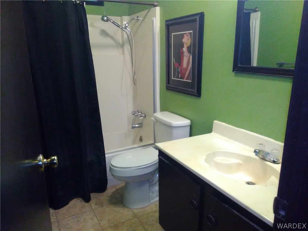 8485 Boundary Peak Road Mohave Valley, AZ 86440 - Photo 34 of 40 a bathroom with a sink and a mirror