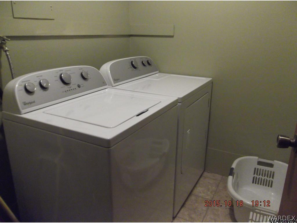 8485 Boundary Peak Road Mohave Valley, AZ 86440 - Photo 36 of 40 a utility room with dryer and washer