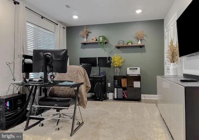 a view of a workspace with furniture