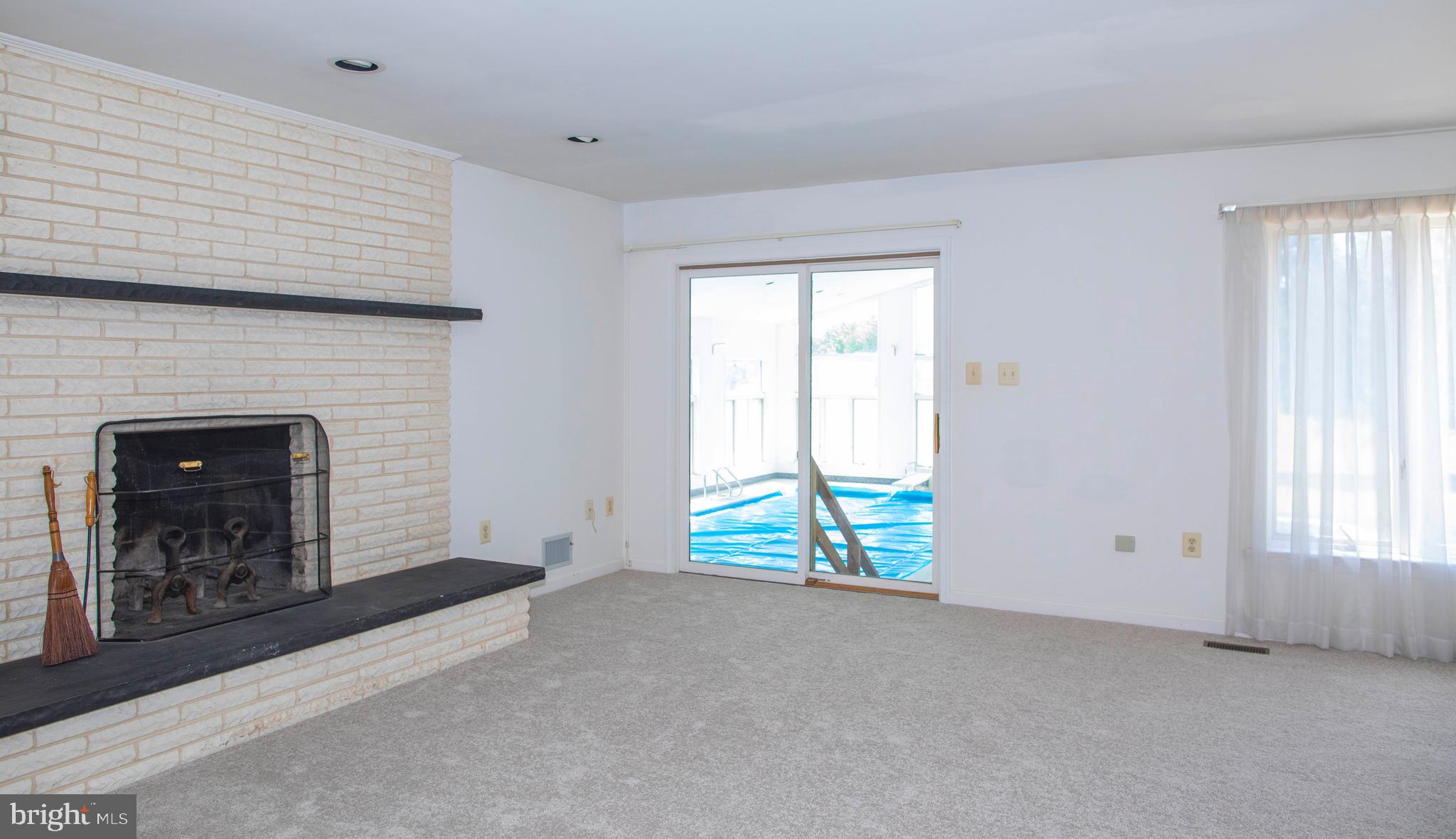 4600 Catharpin Road Gainesville, VA 20155 - Photo 18 of 44 Family room with fireplace & entry to pool