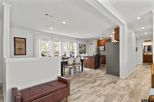 a view of a dining room with furniture window and wooden floor