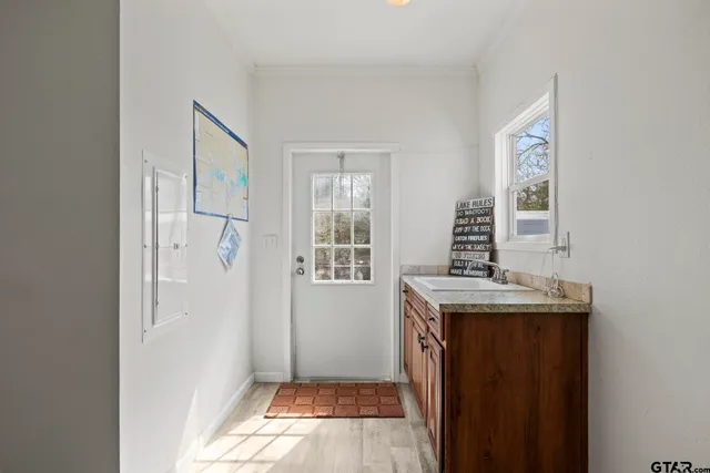 a utility room with sink dryer and washer