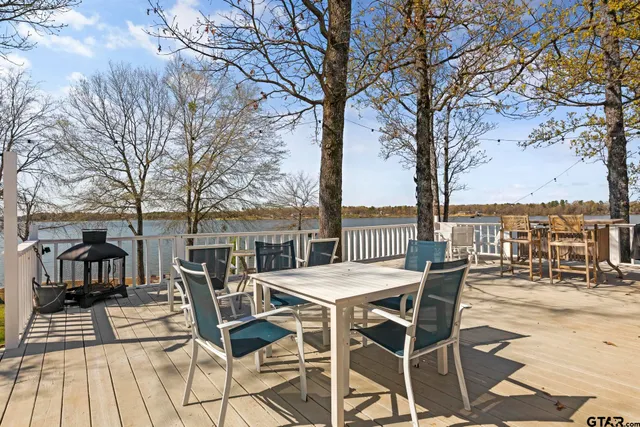 a view of a balcony with mountain view and wooden floor