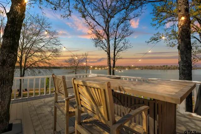a view of a house with a yard covered in snow