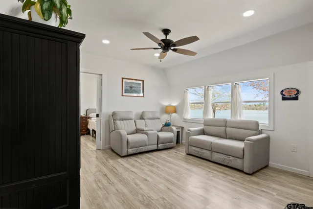 a living room with furniture and windows