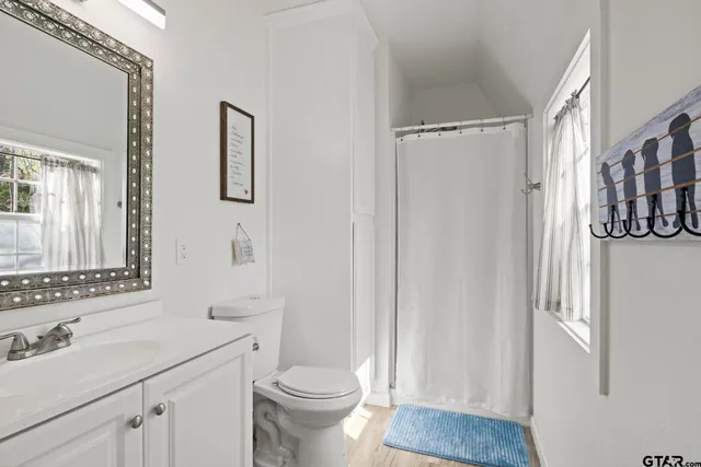 a bedroom with a bed and a table in it