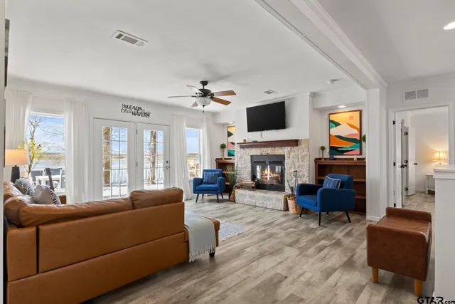 a living room with furniture fireplace and flat screen tv