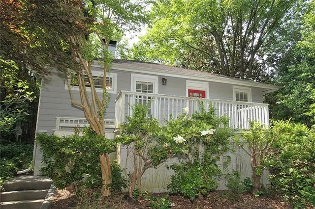 front view of a house with a garden