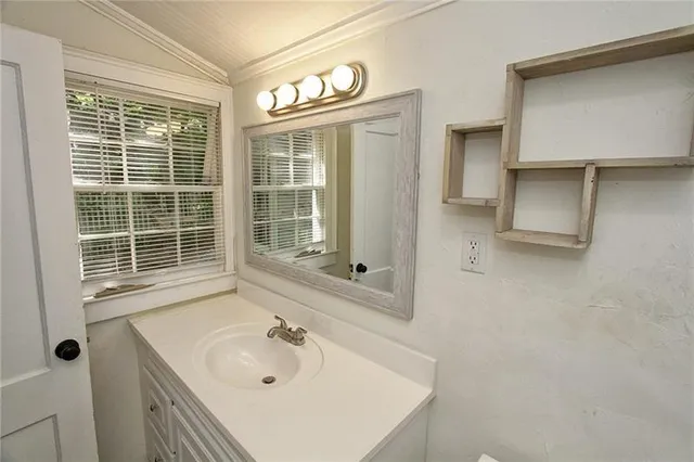 a bathroom with a sink and a bathtub