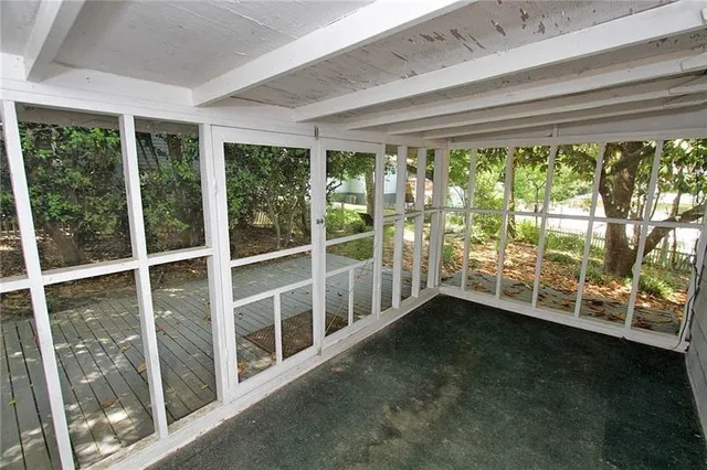 a view of an empty room with a large window