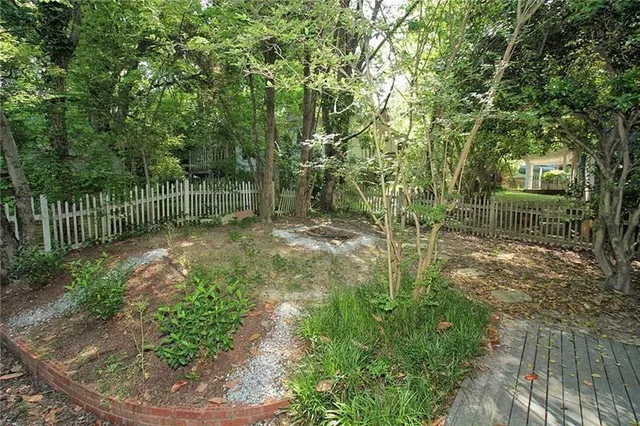 a garden view with a fountain