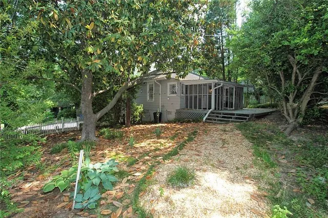a backyard of a house with lots of green space