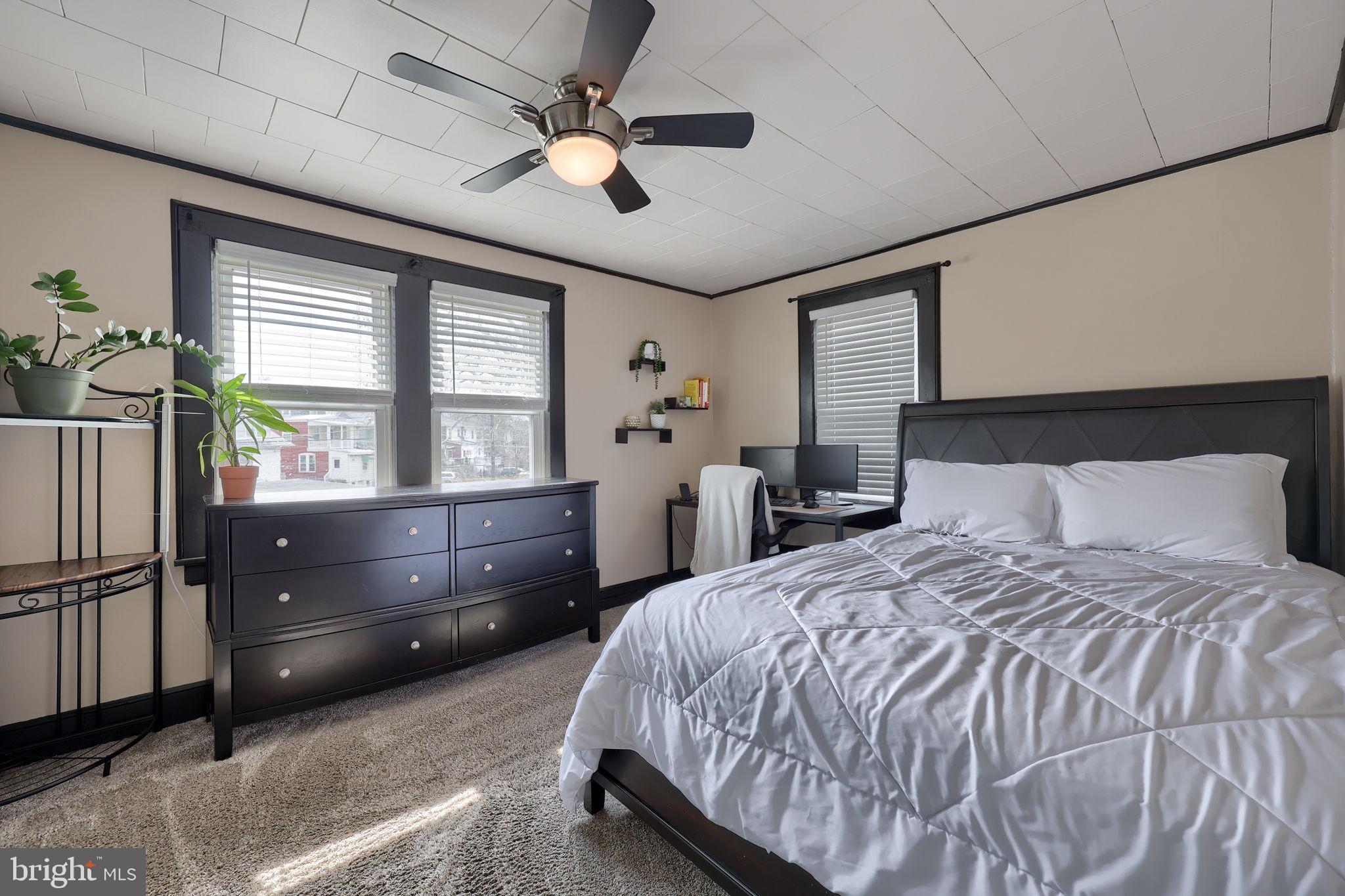 849 Delta Avenue Reading, PA 19605 - Photo 21 of 31 a bedroom with a bed and a large window
