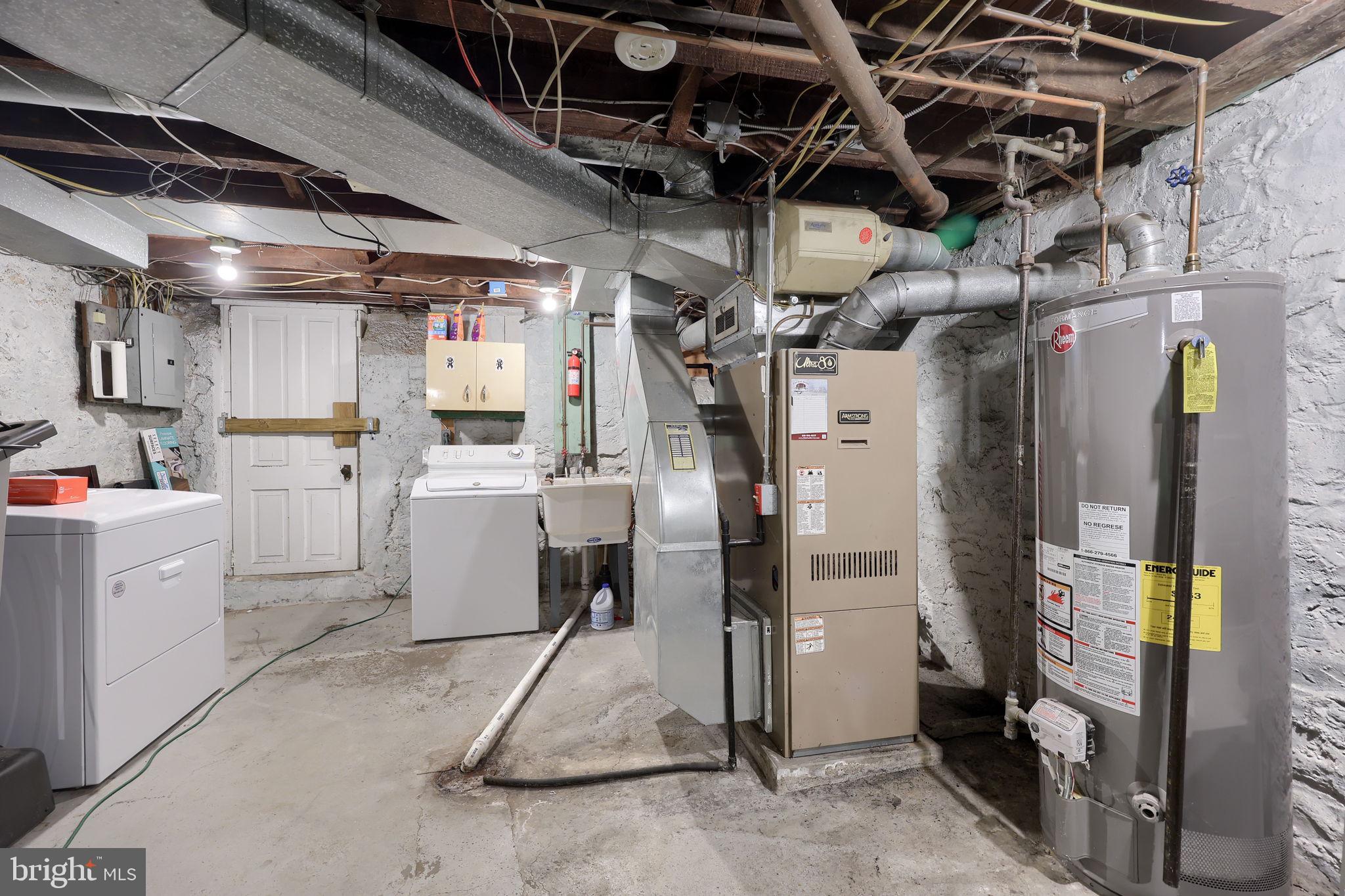 849 Delta Avenue Reading, PA 19605 - Photo 23 of 31 a storage room with dryer and washer