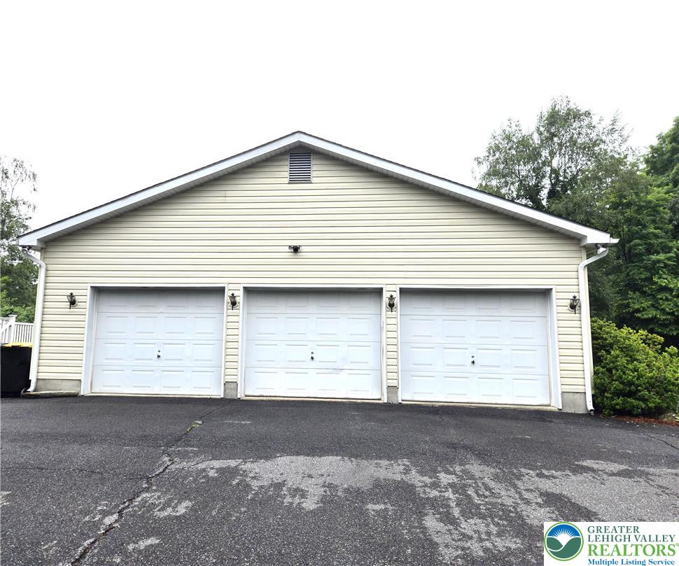 477 Quiet Valley Road Mount Bethel, PA 18343 - Photo 6 of 53 A spacious three-car garage provides ample parking and storage for your vehicles.