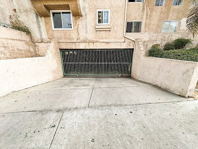 a view of a brick house with many windows