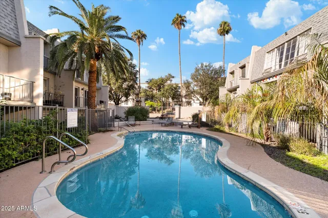 a view of a swimming pool with a patio