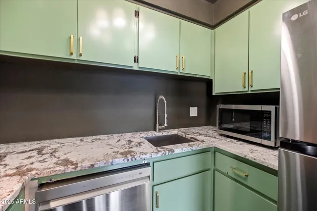 a kitchen with a stove and a wooden cabinets