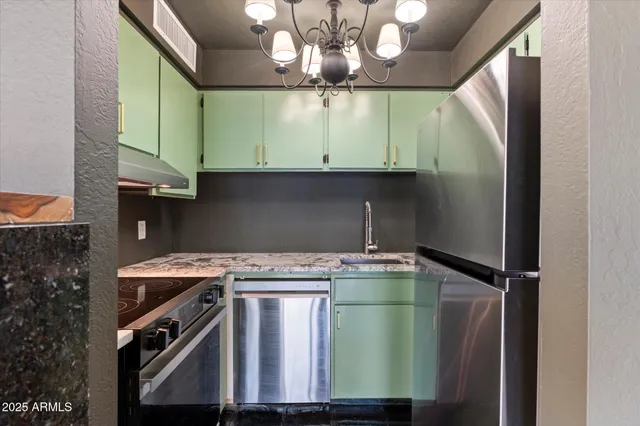 a stove top oven sitting inside of a kitchen
