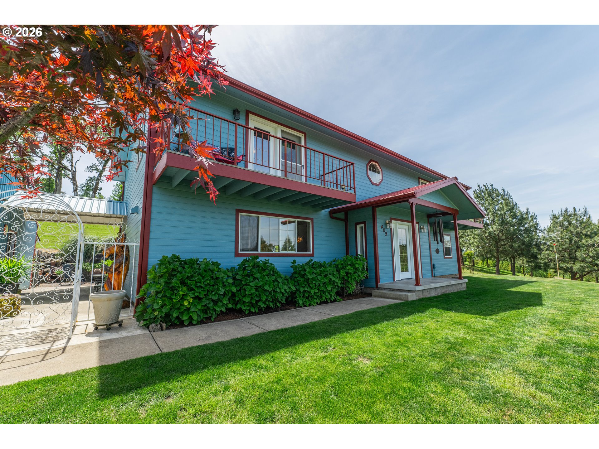 489 Fir Vista Road Sutherlin, OR 97479 - Photo 3 of 47 a front view of a house with a yard table and chairs