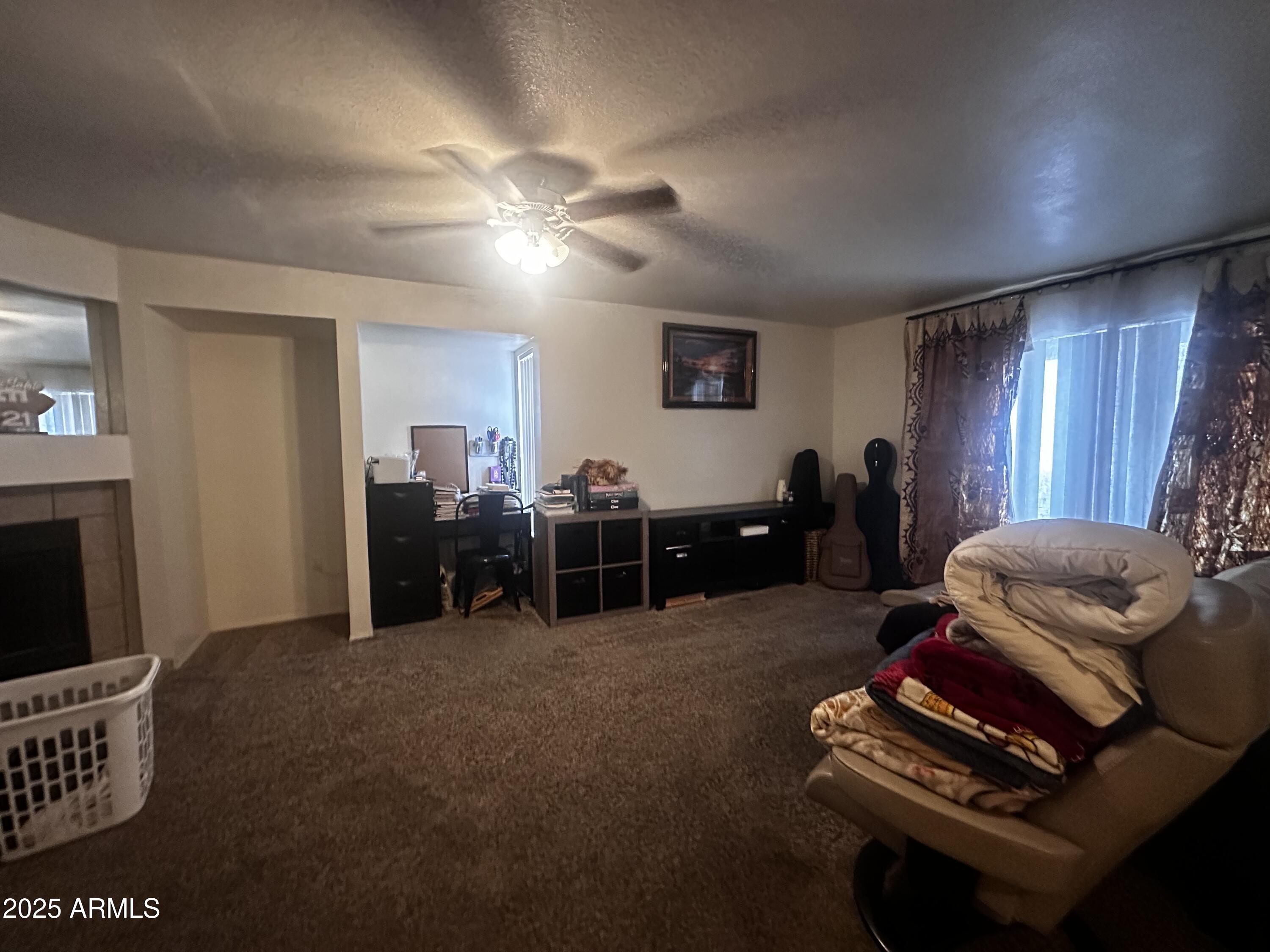 1331 West Baseline Road, Unit 219 Mesa, AZ 85202 - Photo 4 of 17 a living room with furniture and a flat screen tv