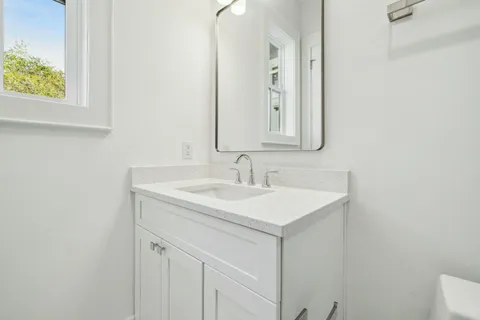 a view of a porch with wooden floor and outdoor space