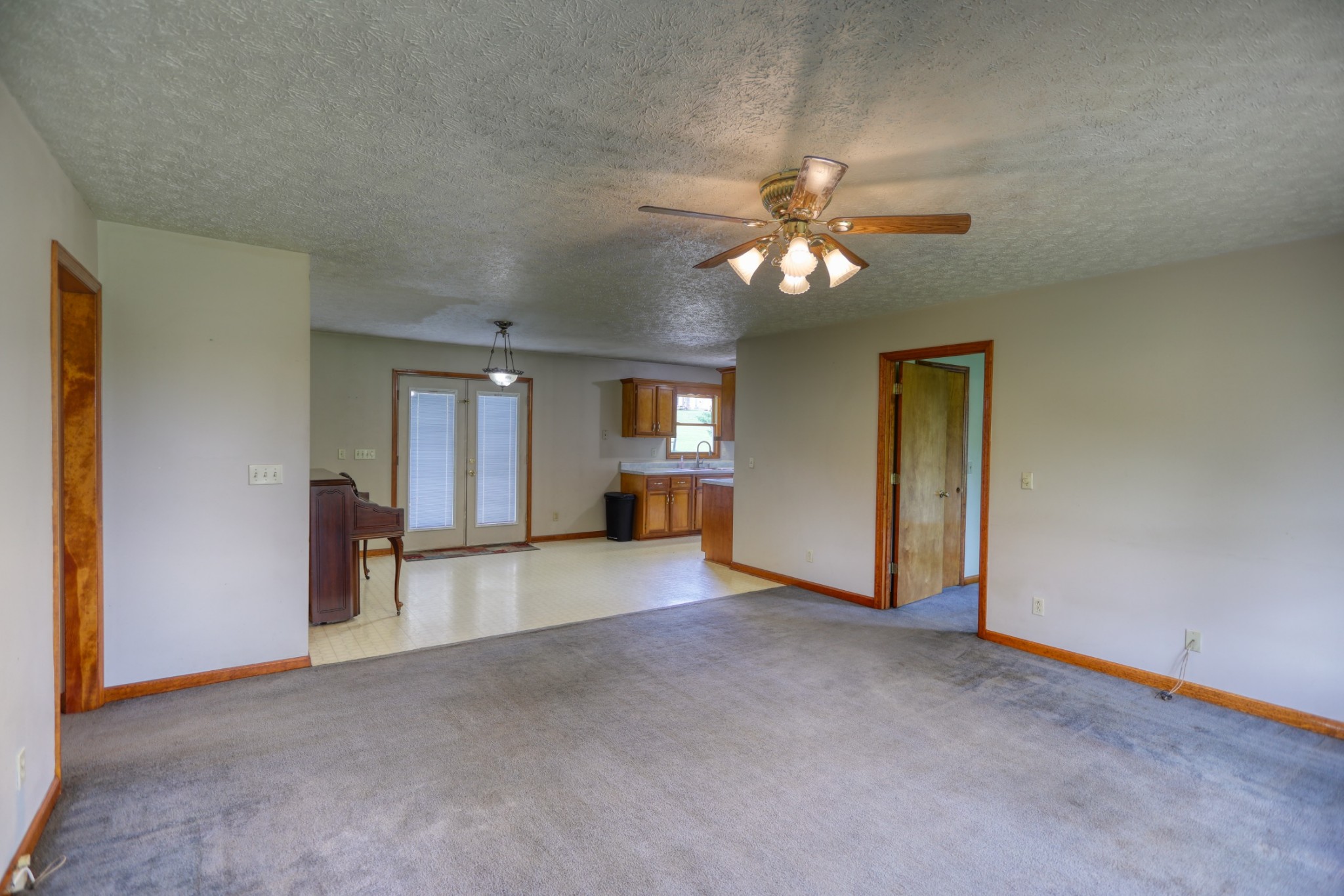 3845 Armstrong Road Springfield, TN 37172 - Photo 9 of 34 a view of a livingroom with a chandelier fan and windows