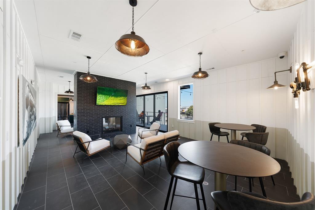 4510 Terry-O Lane, Unit 416 Austin, TX 78745 - Photo 29 of 40 a living room with furniture a dining table and a chandelier