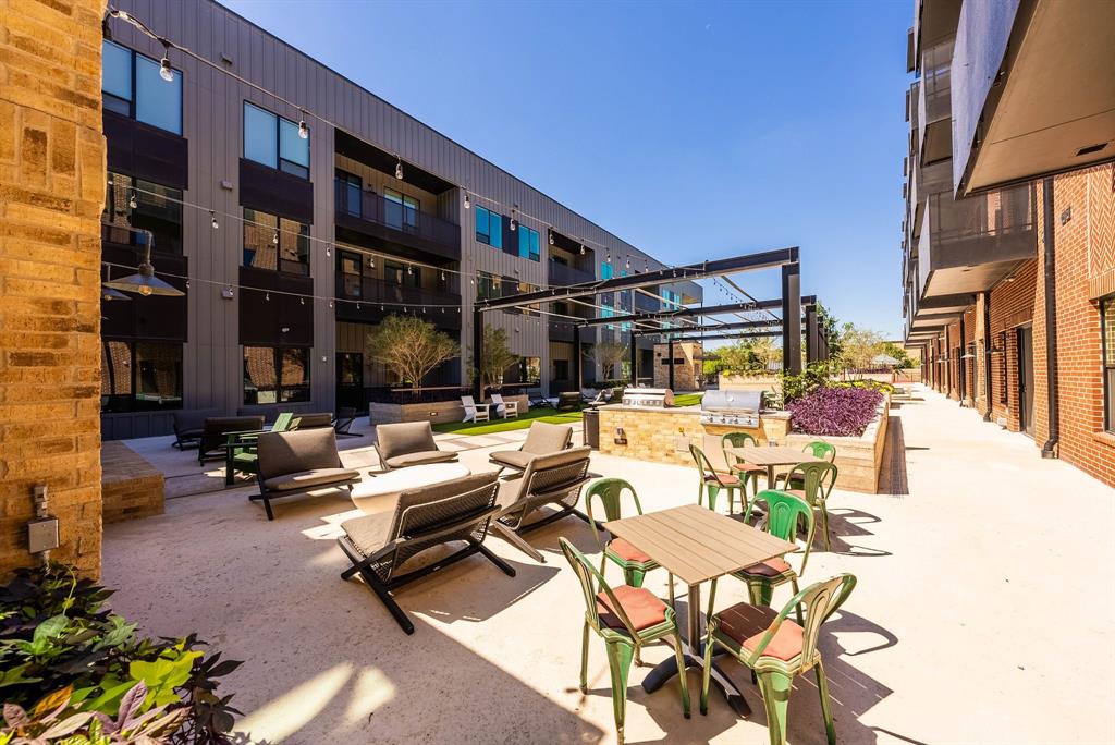 4510 Terry-O Lane, Unit 416 Austin, TX 78745 - Photo 34 of 40 a view of a patio with swimming pool table and chairs