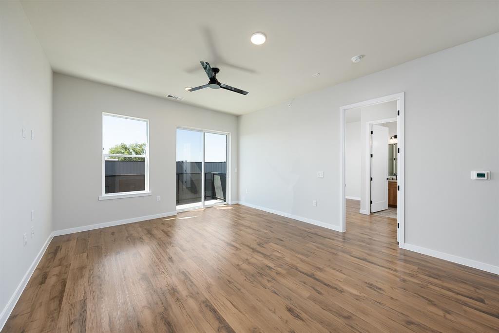 4510 Terry-O Lane, Unit 416 Austin, TX 78745 - Photo 5 of 40 a view of an empty room with wooden floor and a window